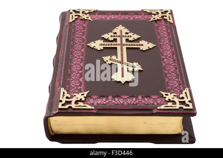 Bible isolated on white background The Bible with golden cross on cover, isolated on white Stock Photo