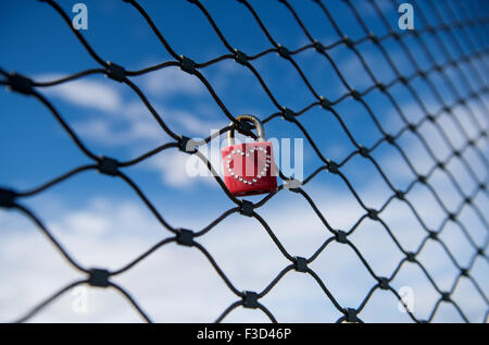 Stuttgart, Germany. 14th Sep, 2015. A padlock with a heart-shaped pattern attached to a security fence at the main station in Stuttgart, Germany, 14 September 2015. PHOTO: MARIJAN MURAT/DPA/Alamy Live News Stock Photo