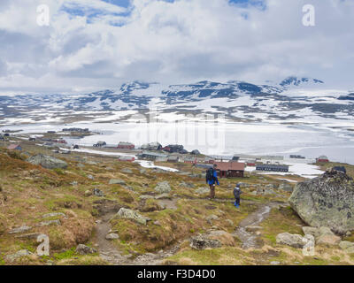 Norwegian mountain scene, young boy and grandad returning from a hike to Finse, Hardangervidda Norway, Stock Photo