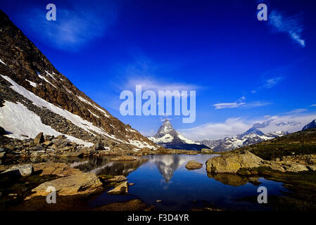 The Matterhorn reflected in a mountain lake above Zermatt. Switzerland. Europe Stock Photo