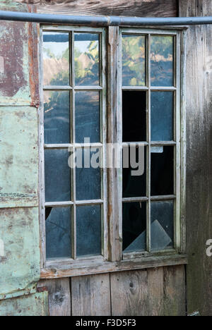 Old broken window closeup. Stock Photo