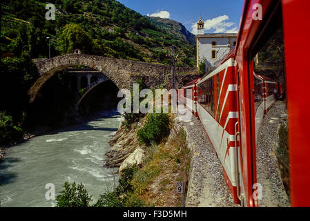 Glacier express railway passing Ritibrücke in Neubrück (Stalden), Switzerland. Stock Photo