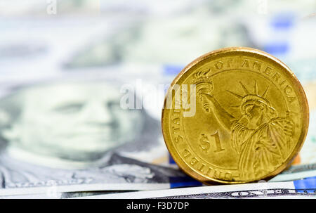 a coin in the dollar on the American banknotes Stock Photo