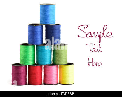 Sewing threads multicolored at white background Stock Photo