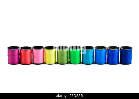 Sewing threads multicolored at white background Stock Photo