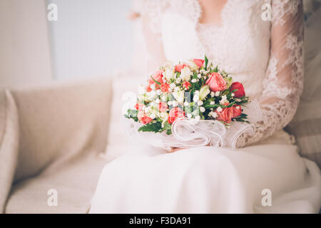 Beautiful wedding bouquet in hands of  the bride Stock Photo