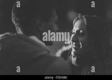 Close-up image of couple in love, man  kisses a woman. Used filters instagram Black-white photo. Stock Photo