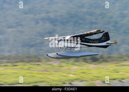 Float plane taking off from Clarence Strait, Ketchikan, Alaska Stock Photo