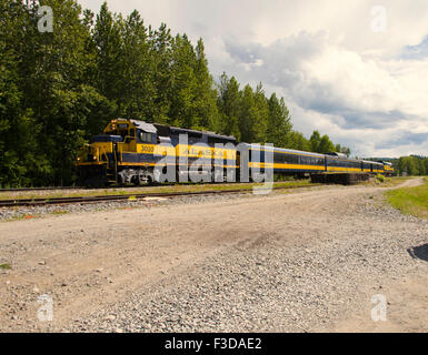 Alaska Railroad passenger train passing Talkeetna station or depot en route for Anchorage Stock Photo