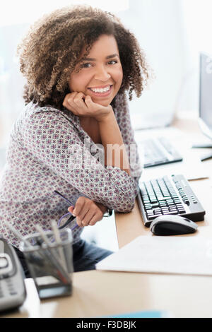 Young woman working at office Stock Photo