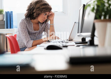 Young woman working at office Stock Photo