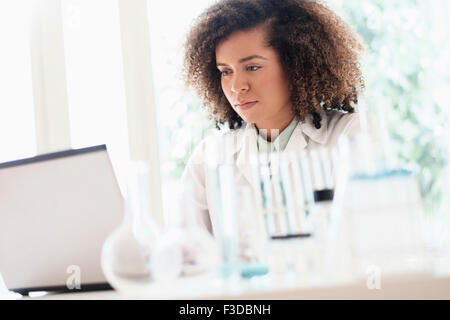 Scientist working on laptop Stock Photo