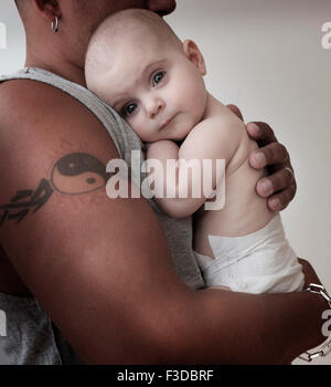 Portrait of baby girl (2-5 months) with her father