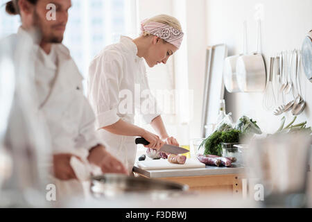 Chefs working in kitchen Stock Photo