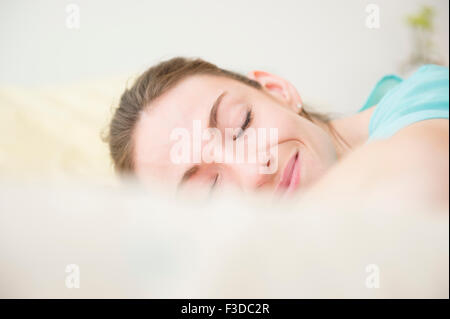 Woman smiling in sleep Stock Photo