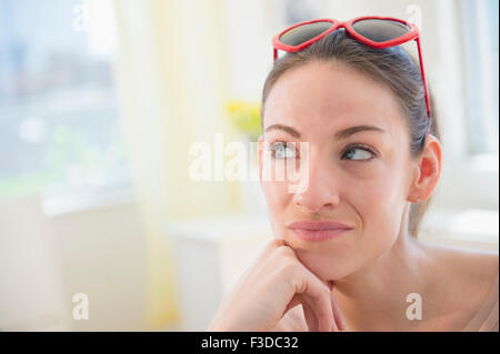Woman at home contemplating Stock Photo
