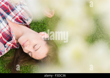 Woman lying on grass Stock Photo