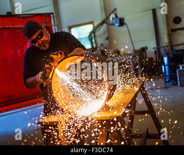 Welder working in metal workshop Stock Photo