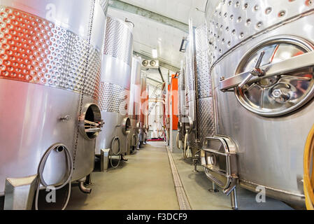 Stainless steel tanks in winery cellar Stock Photo