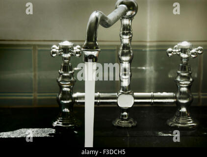 Water running from tap Stock Photo