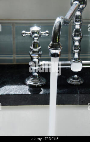 Water running from tap Stock Photo