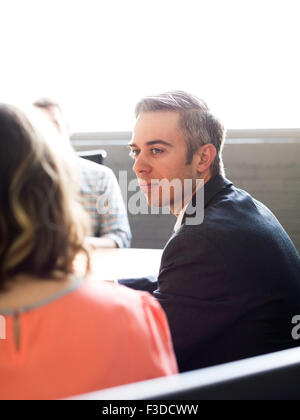 Three office workers during meeting Stock Photo