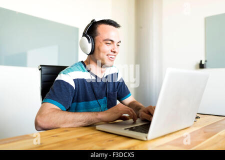 Office worker using laptop Stock Photo