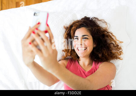 Woman holding smart phone Stock Photo