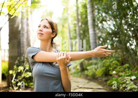 Woman practicing yoga Stock Photo