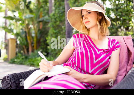 Woman sitting on chair Stock Photo