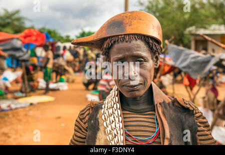 TURMI, OMO VALLEY, ETHIOPIA - MAY 5, 2015: Woman from the Hamar tribe at a local market in south Ethiopia. Stock Photo