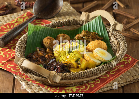 Lamprais. Curry, rice and vegetables in banana leaf. Sri Lanka Food Stock Photo