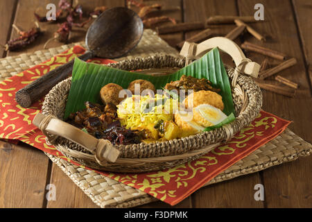 Lamprais. Curry, rice and vegetables in banana leaf. Sri Lanka Food Stock Photo