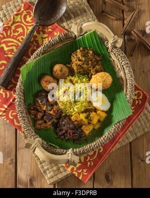 Lamprais. Curry, rice and vegetables in banana leaf. Sri Lanka Food Stock Photo