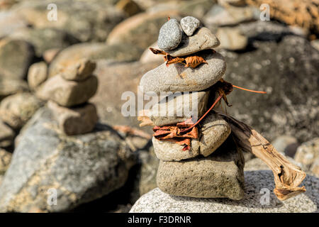 Close-up of stone cairns on the beach of Stanley Park on the Pacific Ocean, Vancouver, British Columbia, Canada, North America. Stock Photo