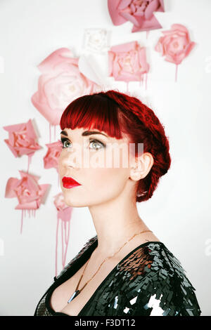 Beautifully romantic red haired girl in a contemporary studio setting Stock Photo
