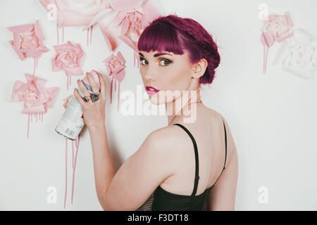 Beautifully romantic red haired girl in a contemporary studio setting Stock Photo