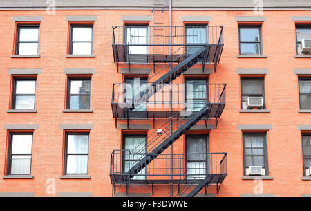 Fire escape ladders, brick building in New York, USA. Stock Photo