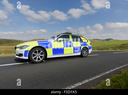 Police Patrol Car in action - police car speeding on a country road Stock Photo