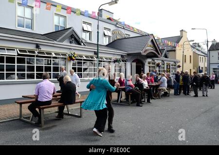 Senior couple dancing in the street during the Matchmaking Festival in Lidoonvarna County Clare Ireland Stock Photo