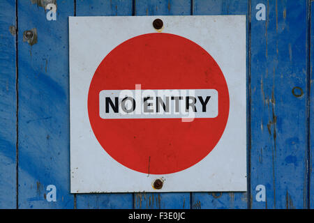 NO ENTRY sign on blue door Stock Photo