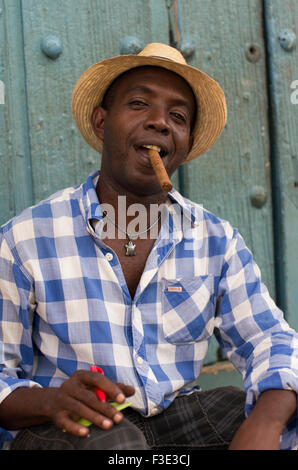 A local man with a Cuban cigar smiles in Trinidad, a town in the centre of Cuba located in the province of Sancti Spiritus.