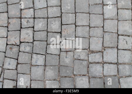 gray smooth surface of pavement tiles in shapes of  little cubes Stock Photo