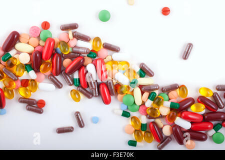 An assortment of pills, tablets and capsules on white background Stock Photo