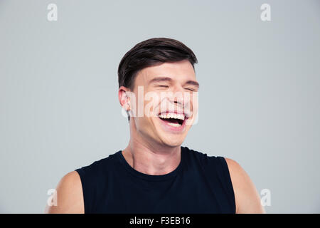 Portrait of a laughing man standing isolated on a white background Stock Photo