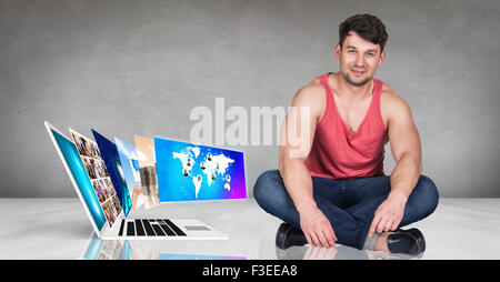 Laptop stands on the floor Stock Photo