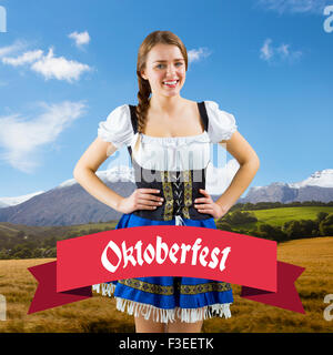 Composite image of pretty oktoberfest girl smiling at camera Stock Photo