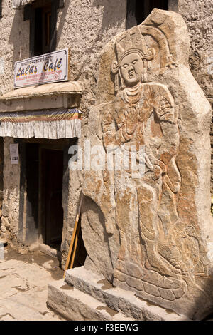 India, Jammu & Kashmir, Ladakh, Leh, C10th Buddhist carving outside  Lala’s art Gallery and Café (Sankar Labrang) in traditional