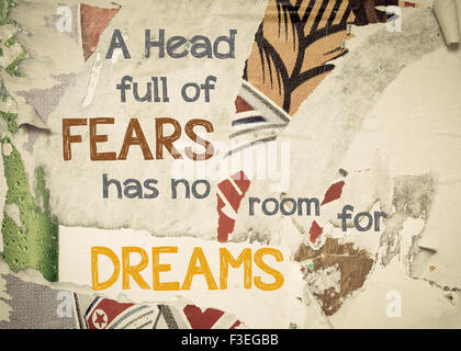 A Head Full Of Fears Has No Room For Dreams- Inspirational message written on vintage grunge background with Old Torn Posters. Motivational concept image Stock Photo