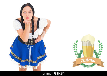 Composite image of pretty oktoberfest girl blowing a kiss Stock Photo